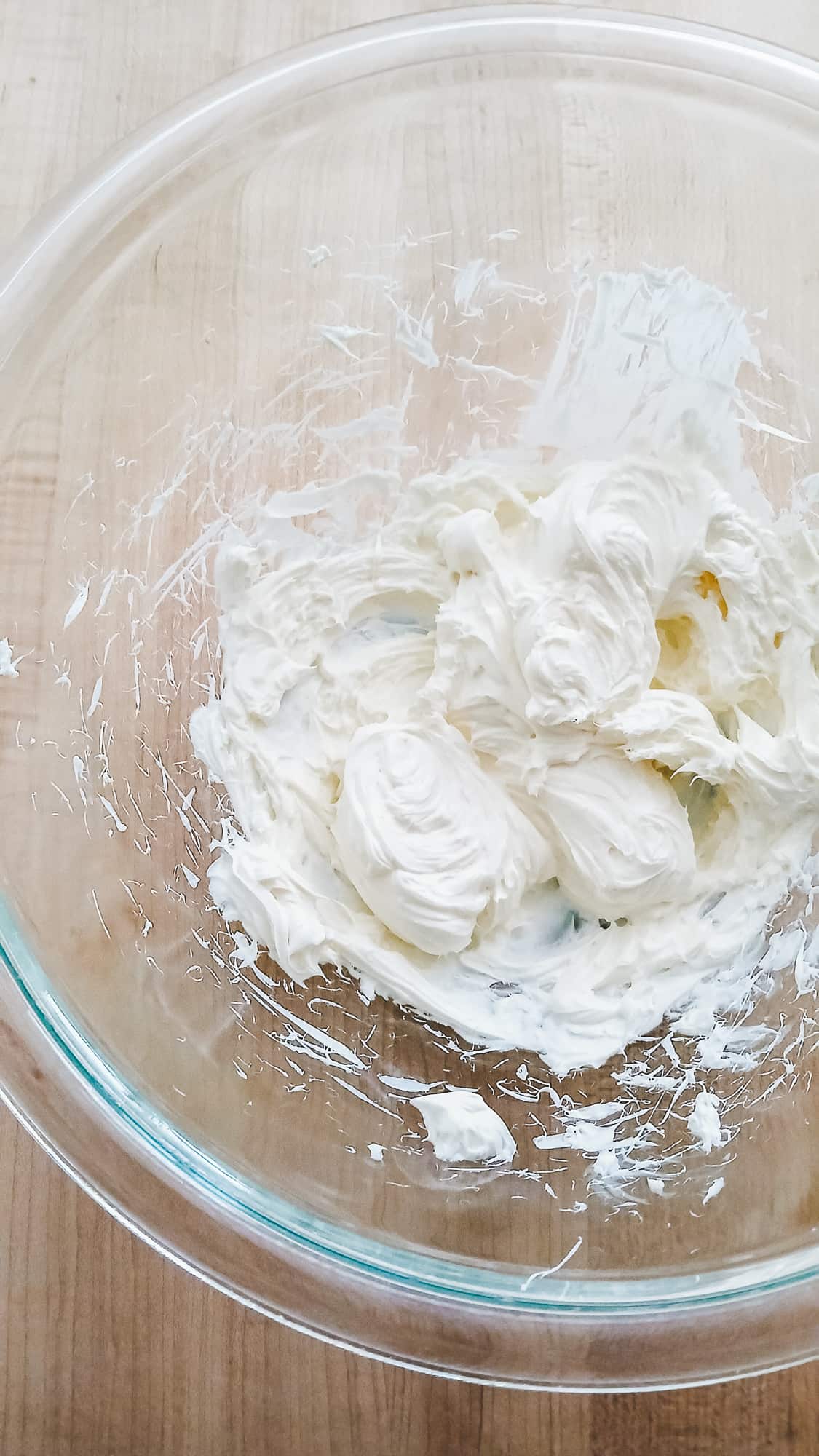 Cream cheese that has been mixed until light and fluffy.