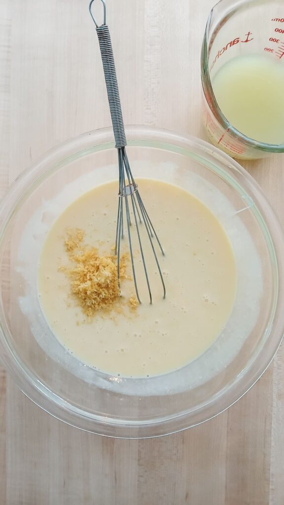 Lemon zest and lemon juice added to the condensed milk mixture as part of making the filling for lemon icebox pie